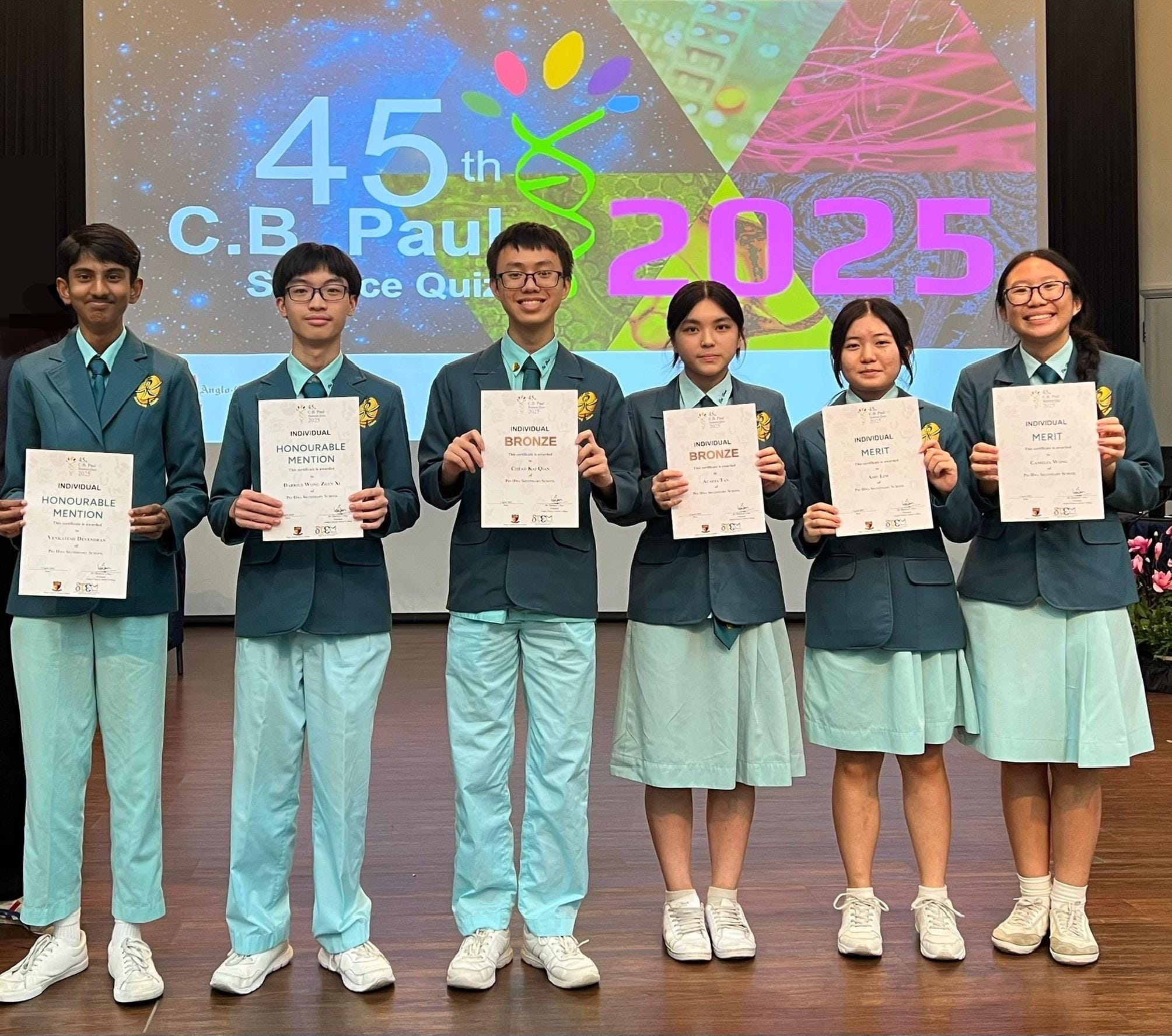 A group of students taking a group photo with their cert